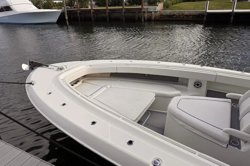Slide: The Image of 2016 Hydra-Sports 4200 Siesta boat docked, featuring spacious seating and sleek design. - 5