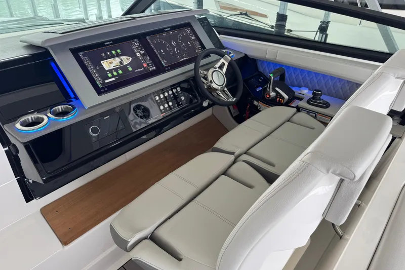 Slide: The Image of 2025 Sea Ray SLX 400 helm with advanced controls and luxurious seating. - 15