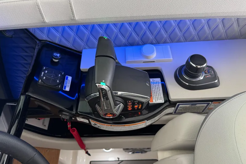 Slide: The Image of Control panel of 2025 Sea Ray SLX 400 boat with modern joystick and throttle. - 18