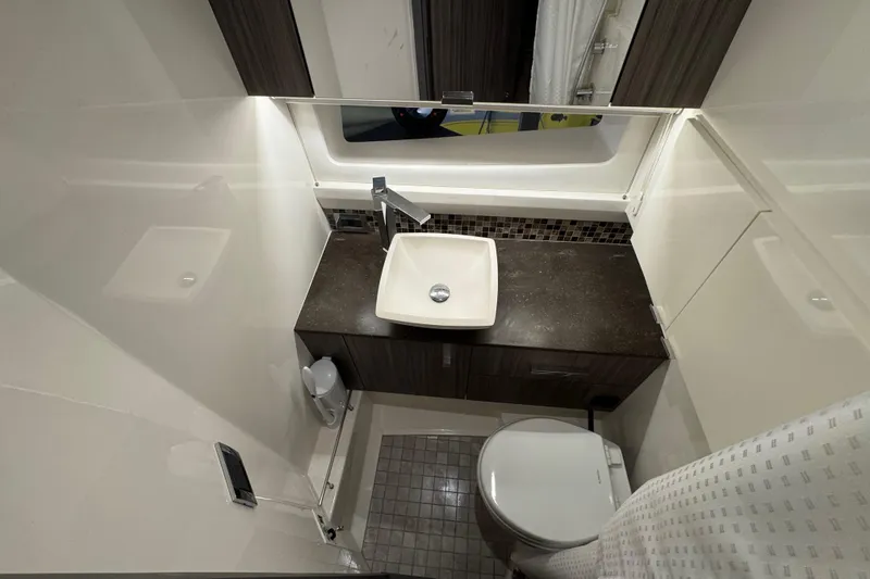 Slide: The Image of Luxurious bathroom interior of 2025 Sea Ray SLX 400 yacht with modern fixtures. - 27