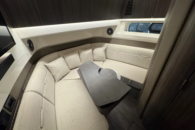 Slide: The Image of Luxurious interior of 2025 Sea Ray SLX 400 yacht with plush seating and modern design. - 28