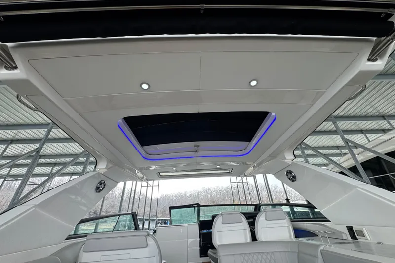 Slide: The Image of Interior view of 2025 Sea Ray SLX 400 yacht with modern seating and lighting. - 32