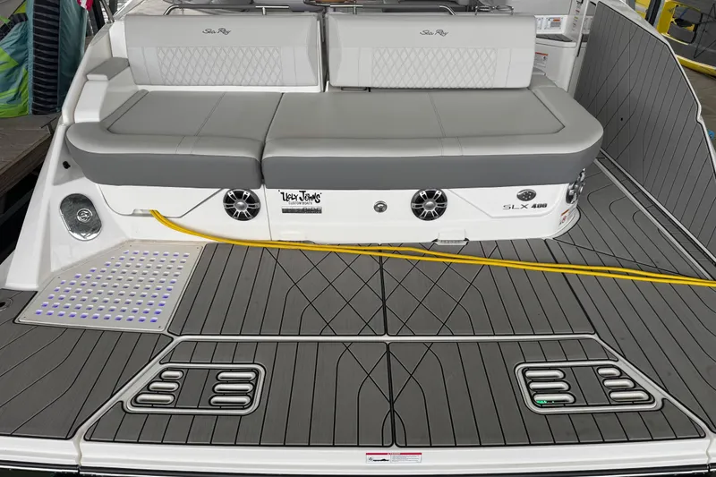 Slide: The Image of 2025 Sea Ray SLX 400 boat deck with cushioned seating and modern design. - 5