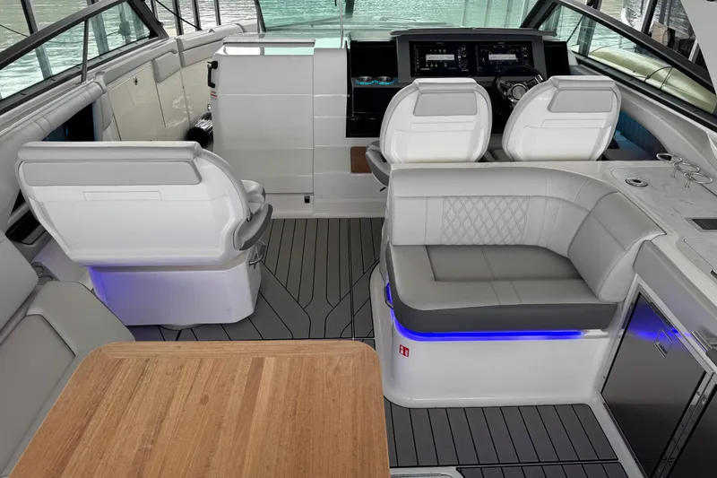 Slide: The Image of Luxurious interior of 2025 Sea Ray SLX 400 boat with modern seating and dashboard. - 8