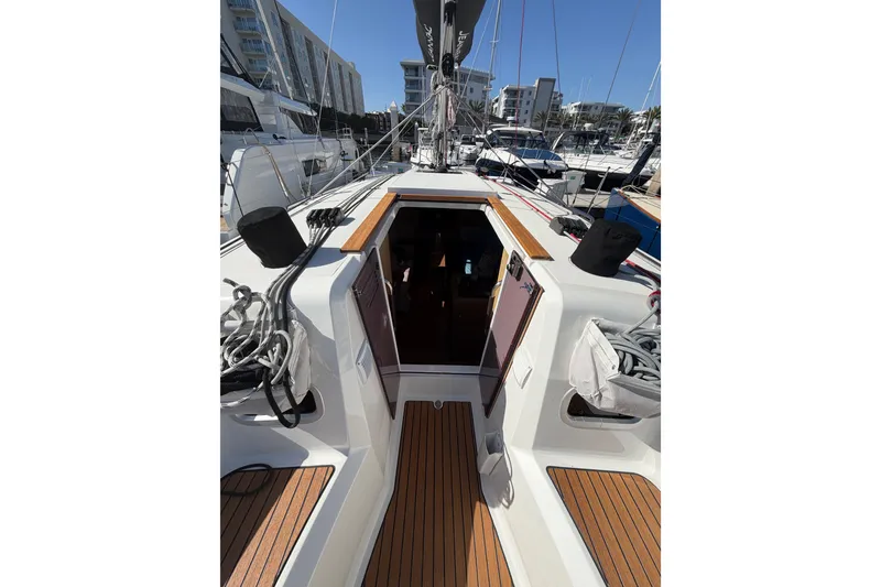 Slide: The Image of 2024 Jeanneau Sun Odyssey 349 sailboat deck with open cabin entrance. - 23