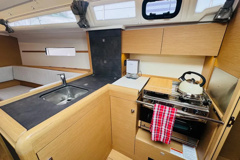 Slide: The Image of Modern kitchen interior of 2024 Jeanneau Sun Odyssey 349 sailboat, featuring sleek design and amenities. - 43
