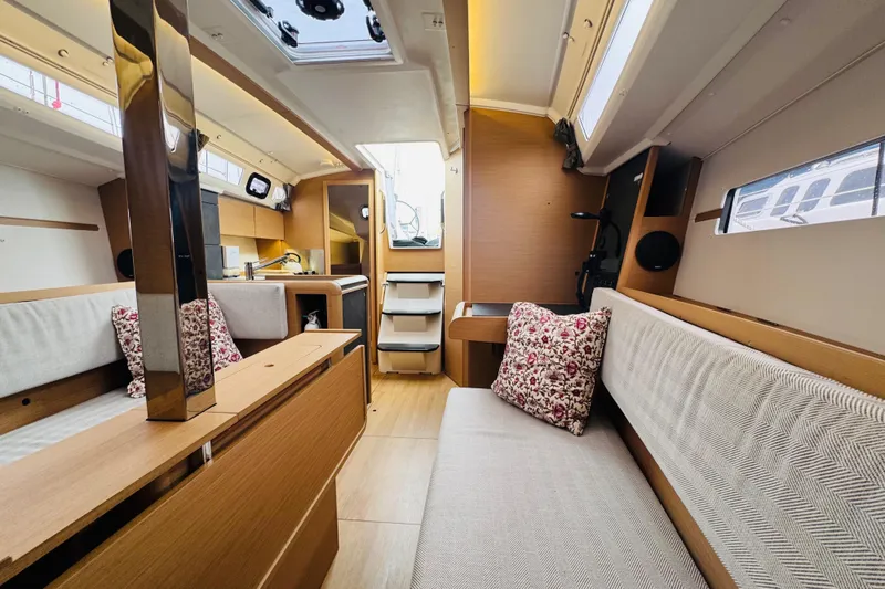 Slide: The Image of 2024 Jeanneau Sun Odyssey 349 interior with modern design and comfortable seating. - 52