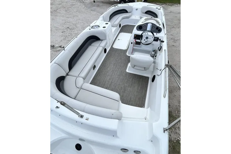 Slide: The Image of 2018 Hurricane SunDeck Sport 232 OB boat interior with spacious seating and modern helm. - 15
