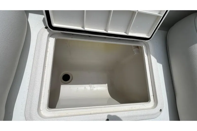 Slide: The Image of Open storage compartment on 2018 Hurricane SunDeck Sport 232 OB boat. - 17