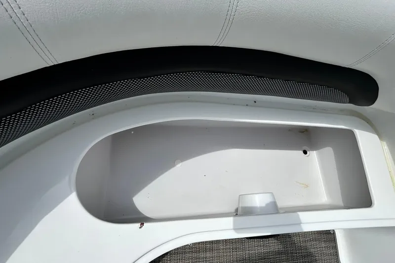 Slide: The Image of Storage compartment of 2018 Hurricane SunDeck Sport 232 OB boat, featuring white interior. - 20