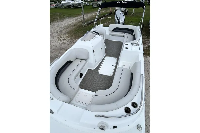 Slide: The Image of 2018 Hurricane SunDeck Sport 232 OB boat with spacious seating and sleek design. - 23