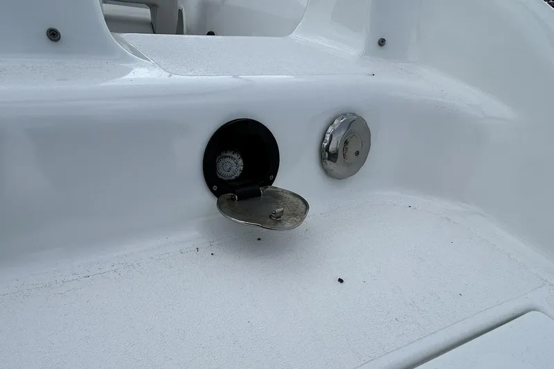 Slide: The Image of 2018 Hurricane SunDeck Sport 232 OB boat fuel cap and gauge detail. - 26
