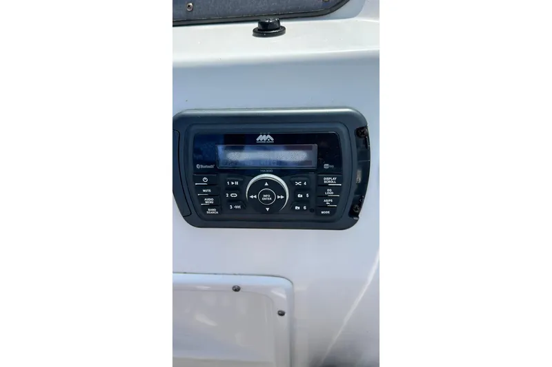 Slide: The Image of Control panel of a 2018 Hurricane SunDeck Sport 232 OB boat, featuring audio system. - 30