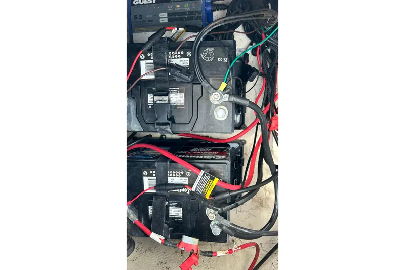 Slide: The Image of 2018 Hurricane SunDeck Sport 232 OB boat batteries with connected cables. - 32