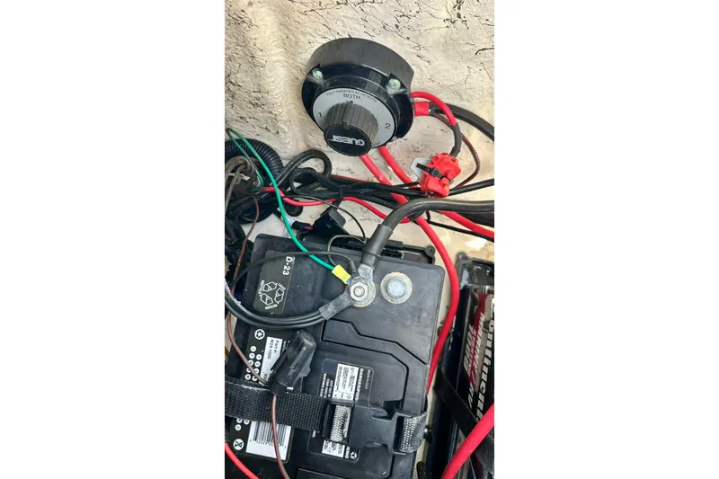 Slide: The Image of Battery and wiring setup in a 2018 Hurricane SunDeck Sport 232 OB boat. - 33