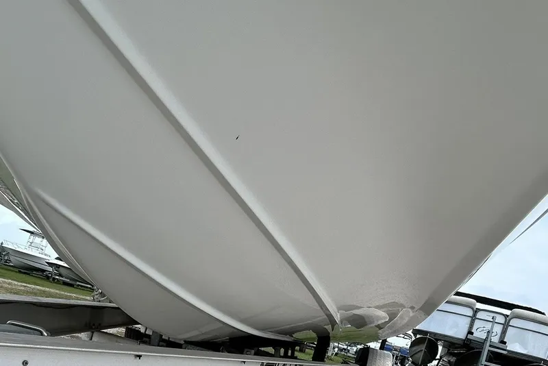 Slide: The Image of 2018 Hurricane SunDeck Sport 232 OB boat hull on trailer, side view. - 4