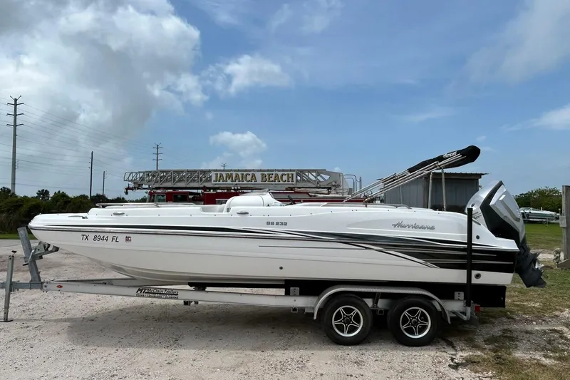Slide: The Image of 2018 Hurricane SunDeck Sport 232 OB boat on trailer at Jamaica Beach. - 6