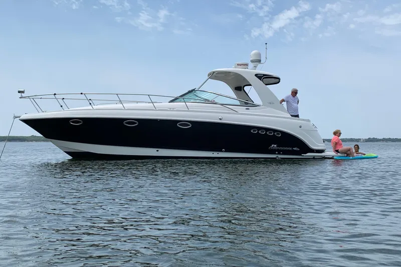 The Image of 2007 Chaparral 350 Signature boat on water with people enjoying a sunny day. - 0