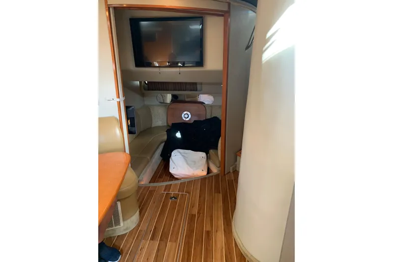 Slide: The Image of Interior of 2007 Chaparral 350 Signature yacht with wood flooring and seating area. - 11