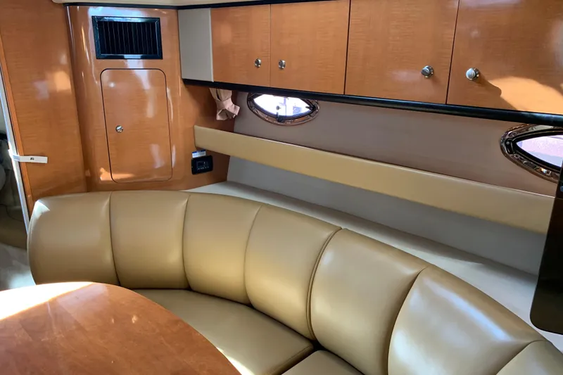 Slide: The Image of Luxurious interior of 2007 Chaparral 350 Signature yacht with leather seating and wood cabinetry. - 12