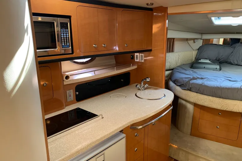Slide: The Image of Interior of 2007 Chaparral 350 Signature yacht with kitchenette and cozy sleeping area. - 14
