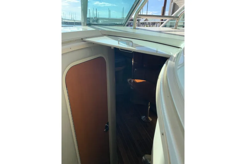 Slide: The Image of 2007 Chaparral 350 Signature cabin entrance with wooden door and interior view. - 16