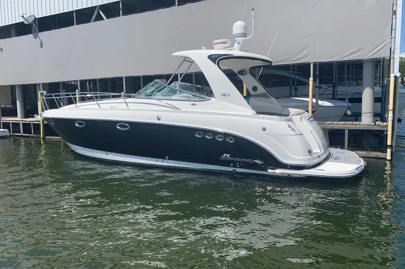 Slide: The Image of 2007 Chaparral 350 Signature boat docked at marina, featuring sleek design and modern amenities. - 3