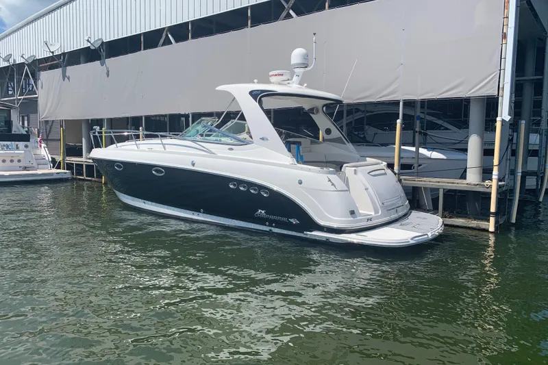 Slide: The Image of 2007 Chaparral 350 Signature yacht docked at marina, featuring sleek design and modern amenities. - 4