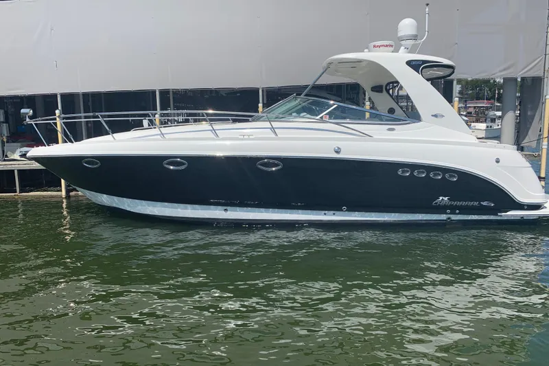 Slide: The Image of 2007 Chaparral 350 Signature boat docked on calm water. - 5