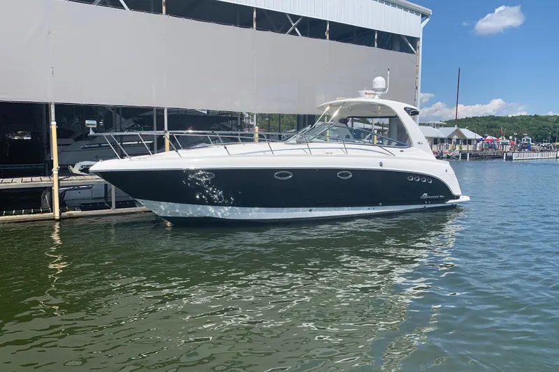 Slide: The Image of 2007 Chaparral 350 Signature yacht docked at marina under clear blue sky. - 6