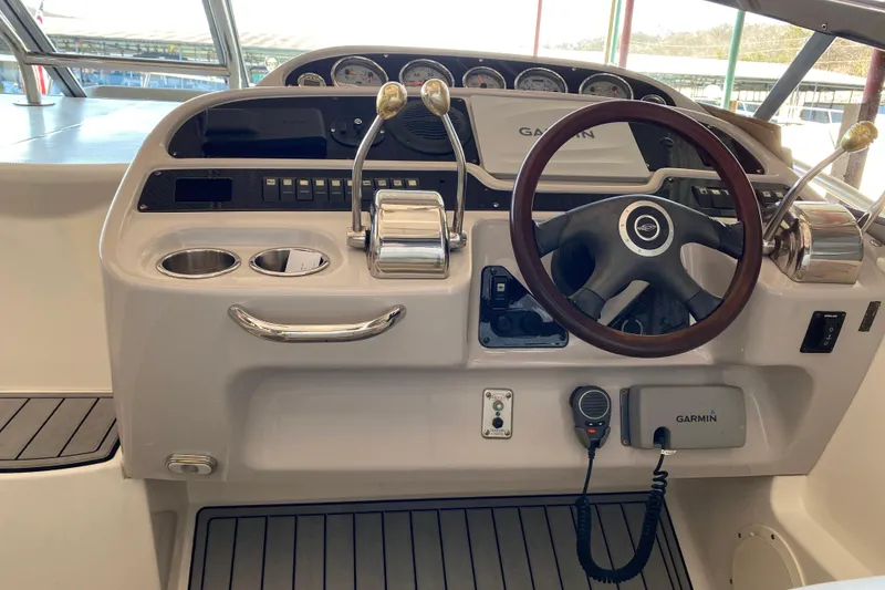 Slide: The Image of Cockpit of 2007 Chaparral 350 Signature with Garmin navigation and dual throttle controls. - 9