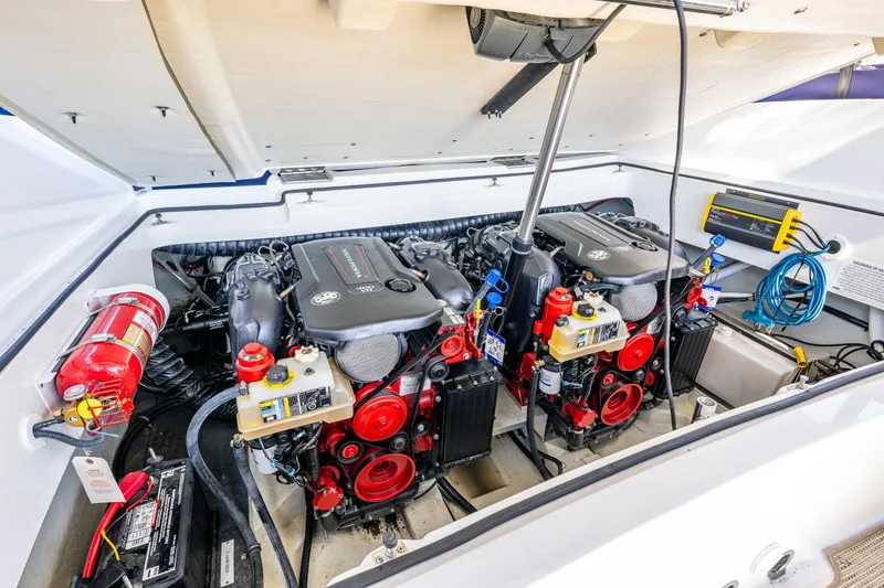 Slide: The Image of Engine compartment of a 2019 Cobalt R30 boat, featuring dual engines and safety equipment. - 15