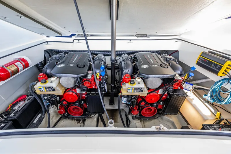 Slide: The Image of Engine compartment of a 2019 Cobalt R30 boat, featuring dual powerful engines. - 16