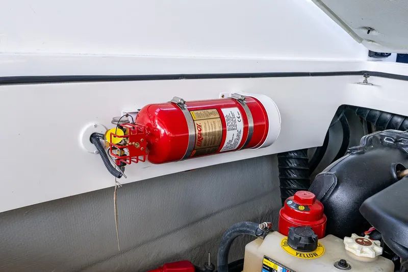 Slide: The Image of Fire extinguisher mounted in 2019 Cobalt R30 boat engine compartment. - 18