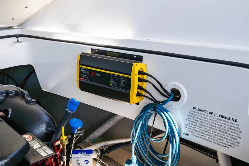 Slide: The Image of Engine compartment of 2019 Cobalt R30 with ProSportHD20Plus charger and oil discharge warning. - 19