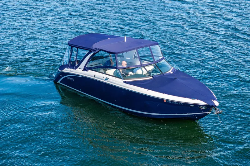Slide: The Image of 2019 Cobalt R30 boat cruising on clear blue water. - 21