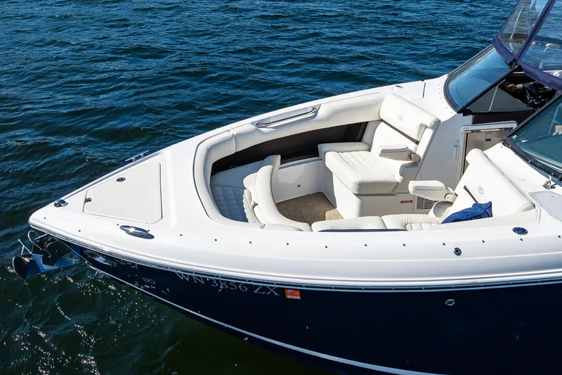 Slide: The Image of 2019 Cobalt R30 boat with white seating, cruising on blue water. - 23