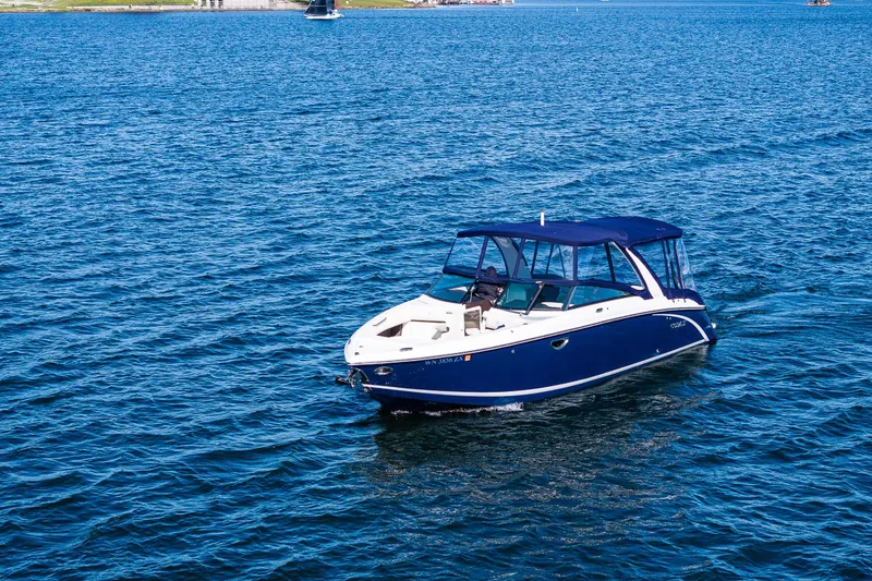 Slide: The Image of 2019 Cobalt R30 boat cruising on open blue water. - 33