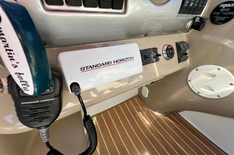 Slide: The Image of 2007 Larson Cabrio 310 dashboard with Standard Horizon marine radio equipment. - 26