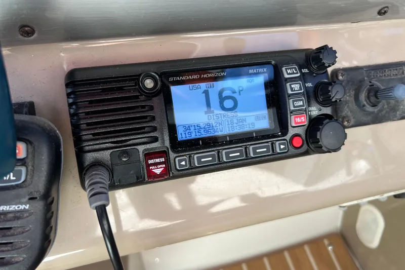 Slide: The Image of Standard Horizon marine radio on 2007 Larson Cabrio 310 boat dashboard. - 27