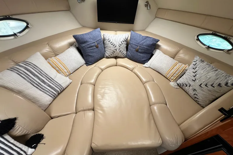 Slide: The Image of Luxurious 2007 Larson Cabrio 310 cabin interior with plush seating and decorative pillows. - 45