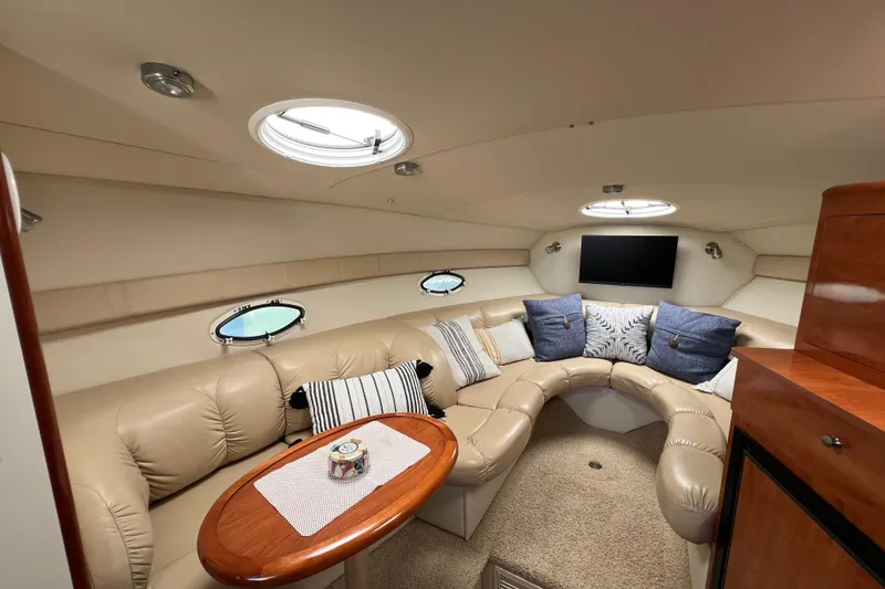 Slide: The Image of Luxurious interior of a 2007 Larson Cabrio 310 yacht with plush seating and modern decor. - 47