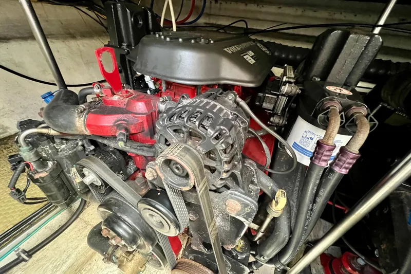 Slide: The Image of Engine of a 2007 Larson Cabrio 310 boat, featuring detailed components and wiring. - 51