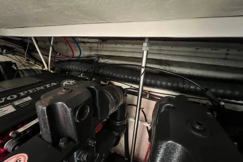 Slide: The Image of Engine compartment of a 2007 Larson Cabrio 310 boat with Volvo Penta components. - 55