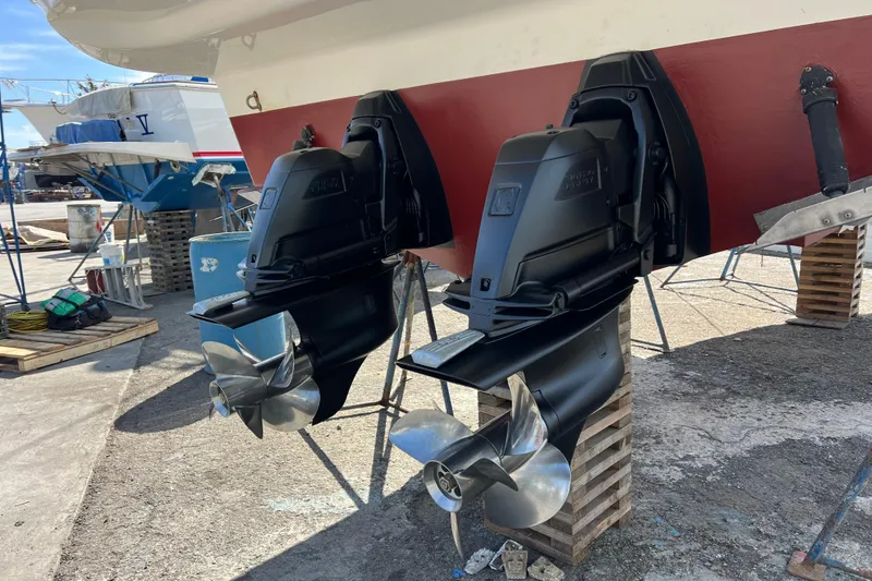 Slide: The Image of Larson Cabrio 310 2007 boat engines on shipyard grounds. - 7