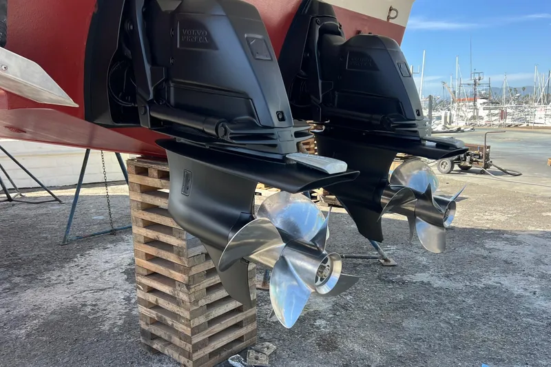 Slide: The Image of 2007 Larson Cabrio 310 boat with Volvo Penta outdrives on dry dock. - 9