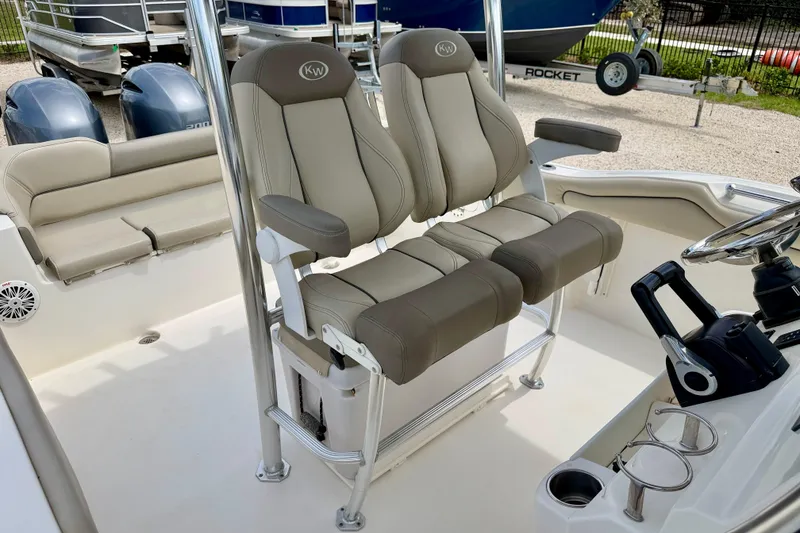 Slide: The Image of 2021 Key West 263 FS boat interior with dual captain seats and steering console. - 10