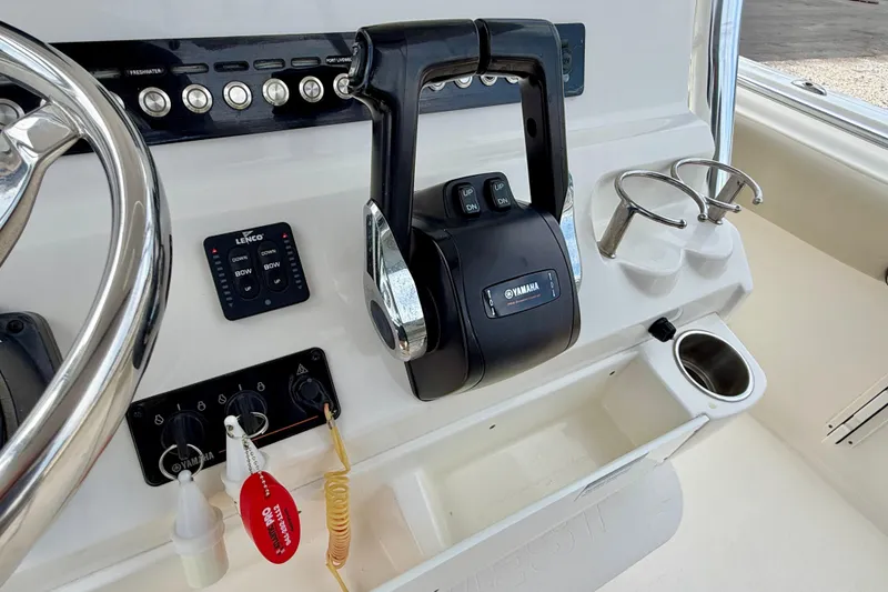 Slide: The Image of Control panel of 2021 Key West 263 FS boat with Yamaha throttle. - 15