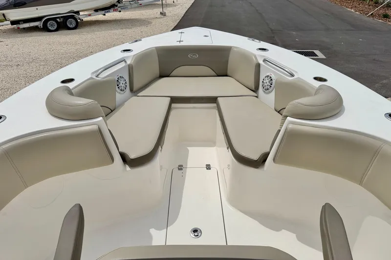 Slide: The Image of 2021 Key West 263 FS boat interior with cushioned seating and speakers. - 22