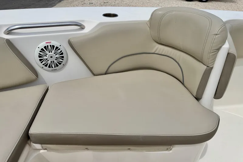 Slide: The Image of 2021 Key West 263 FS boat seating with speaker and cup holder. - 24